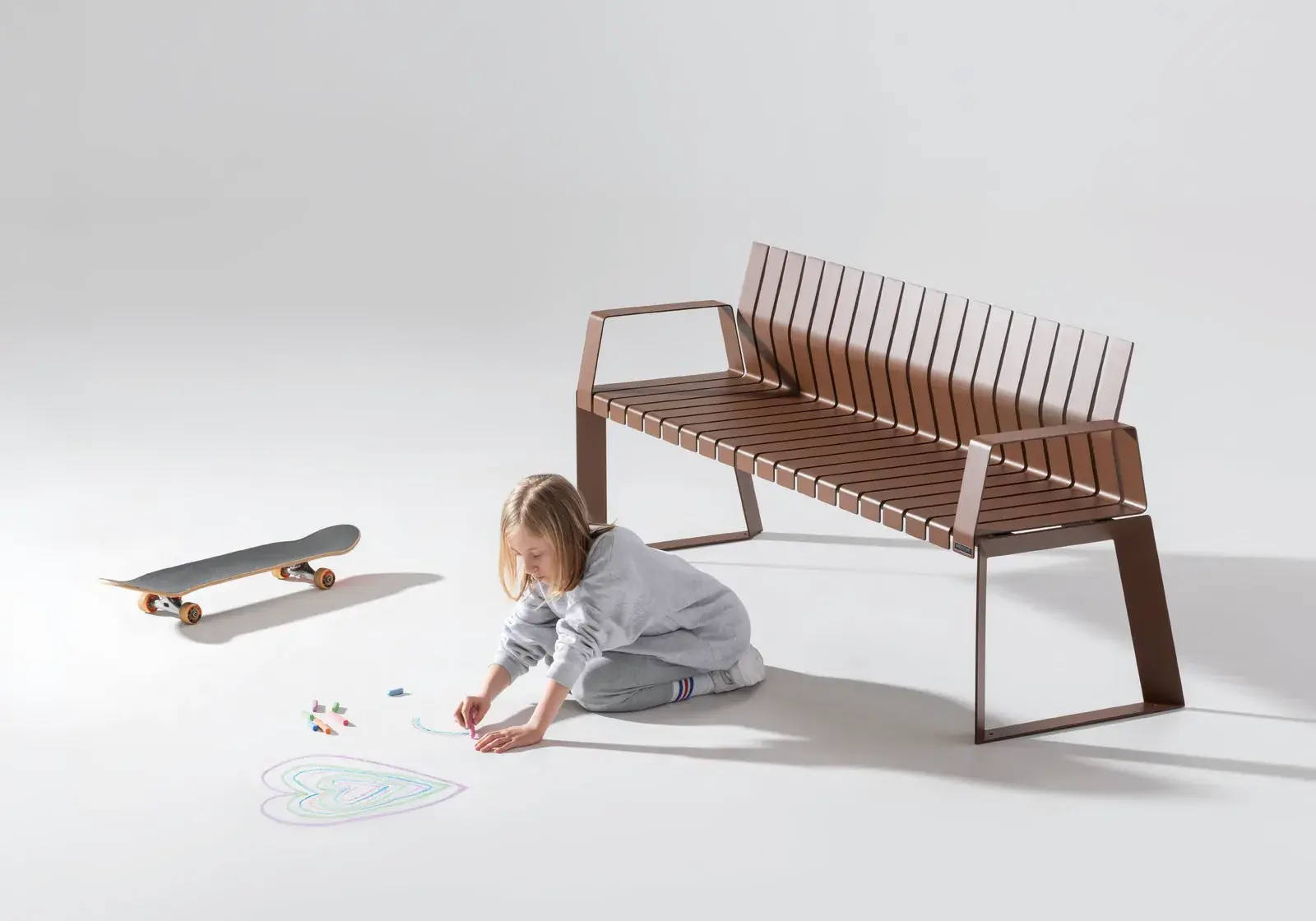 Brown Liberty.080 bench with a child drawing beside it