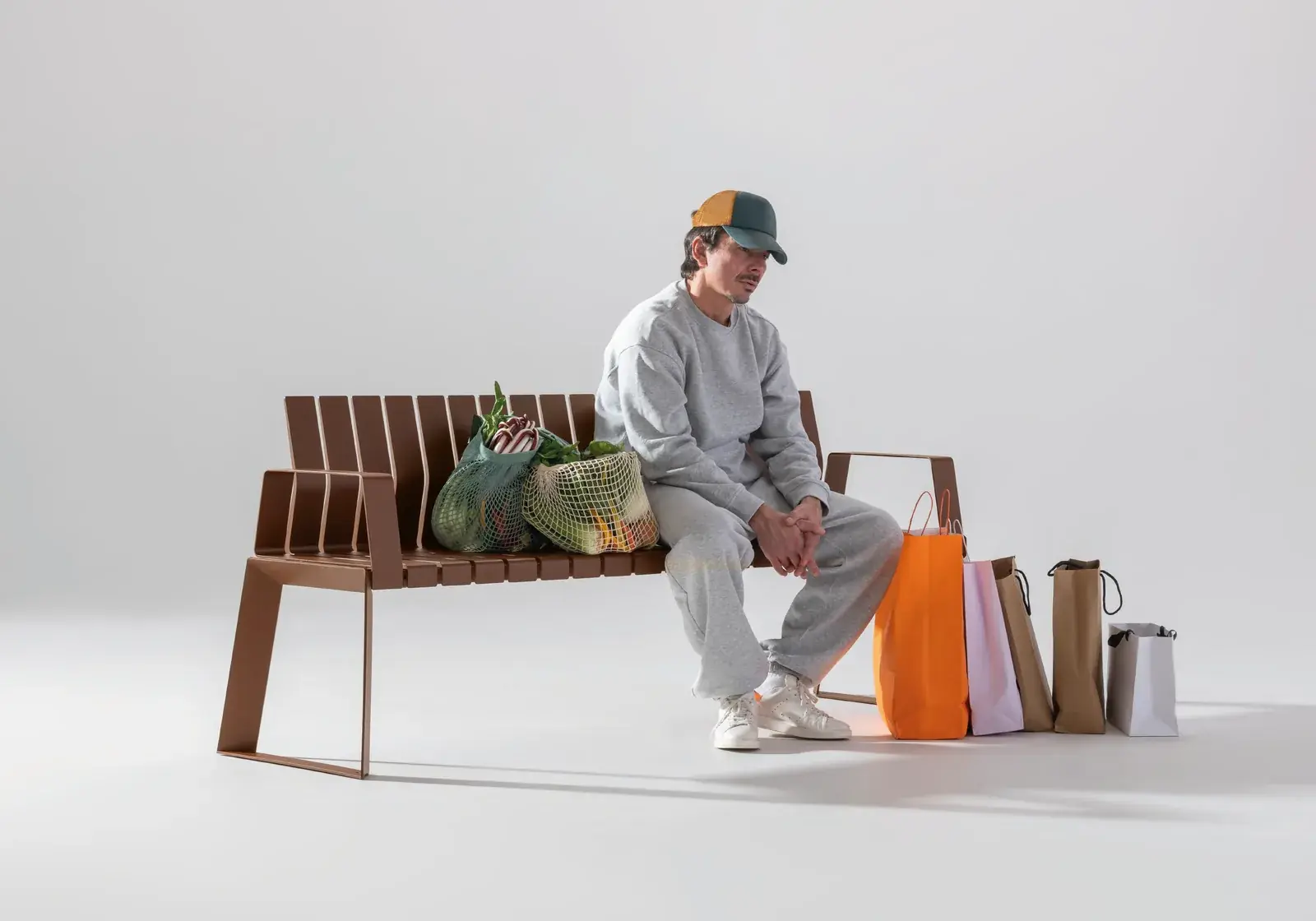 Brown Liberty.080 bench with a man and his shopping